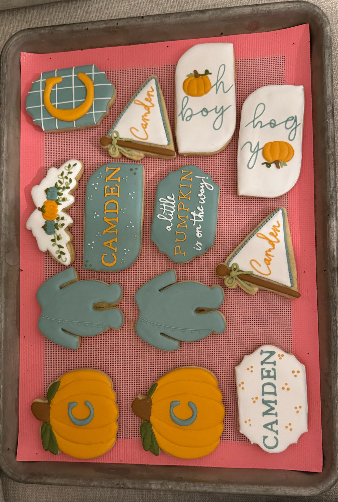 Camden baby shower cookies with pumpkins, onesies and pennants